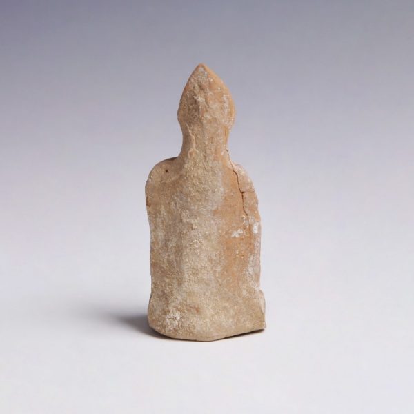 A Greek Terracotta Figurine of a Seated Man