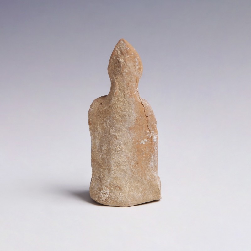 A Greek Terracotta Figurine of a Seated Man A Greek Terracotta Figurine of a Seated Man
