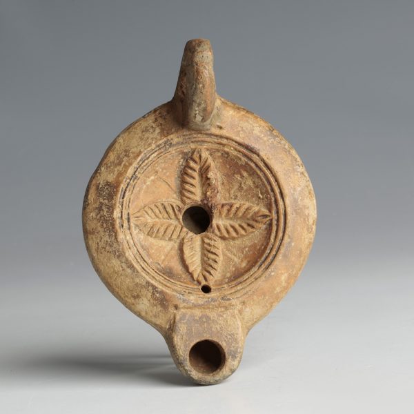 A Roman Terracotta Oil Lamp with Rosette