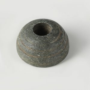 decorated stone spindle whorl
