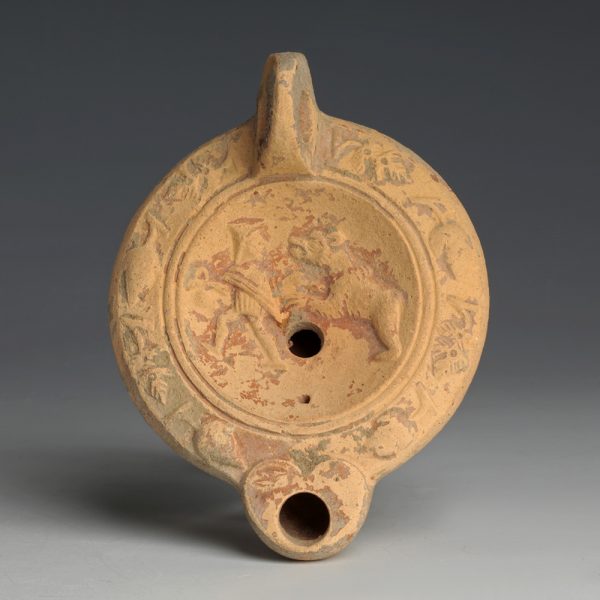 A Roman Terracotta Oil Lamp with a Bestiarius
