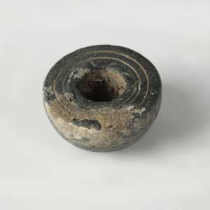 stone decorated spindle whorl