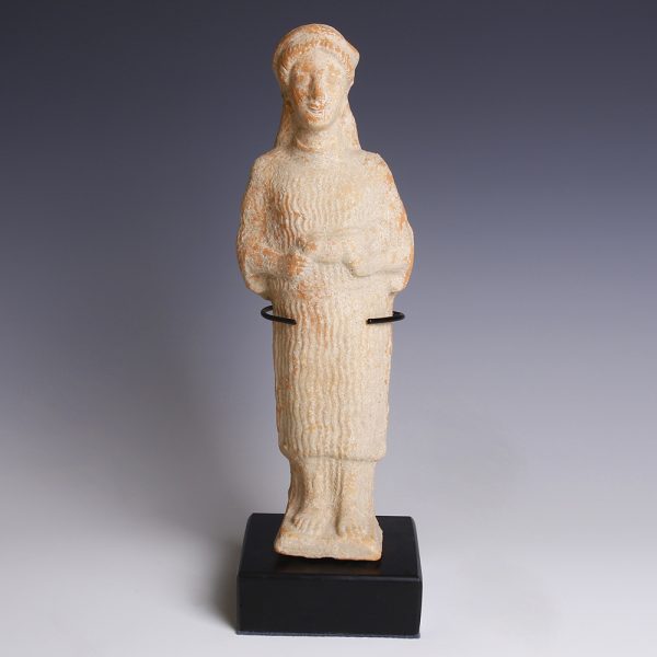 A Greek Terracotta Female Votary with Piglet