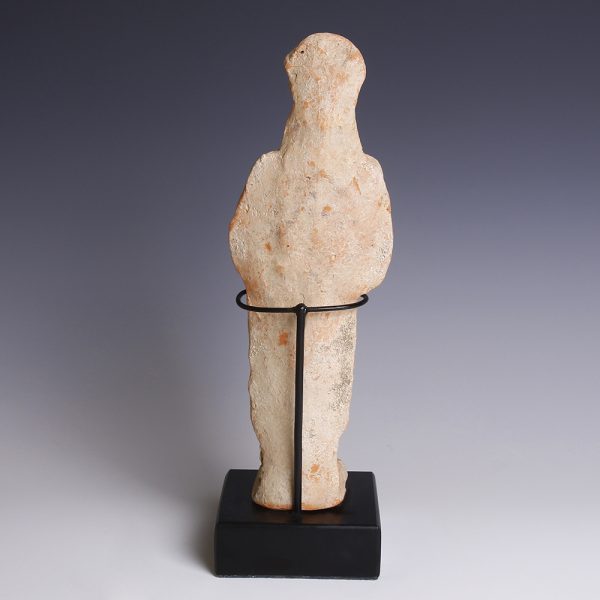 A Greek Terracotta Female Votary with Piglet