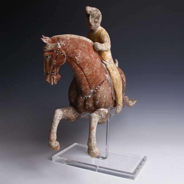 A Pair of Chinese Painted Terracotta Female Polo Players with Horses