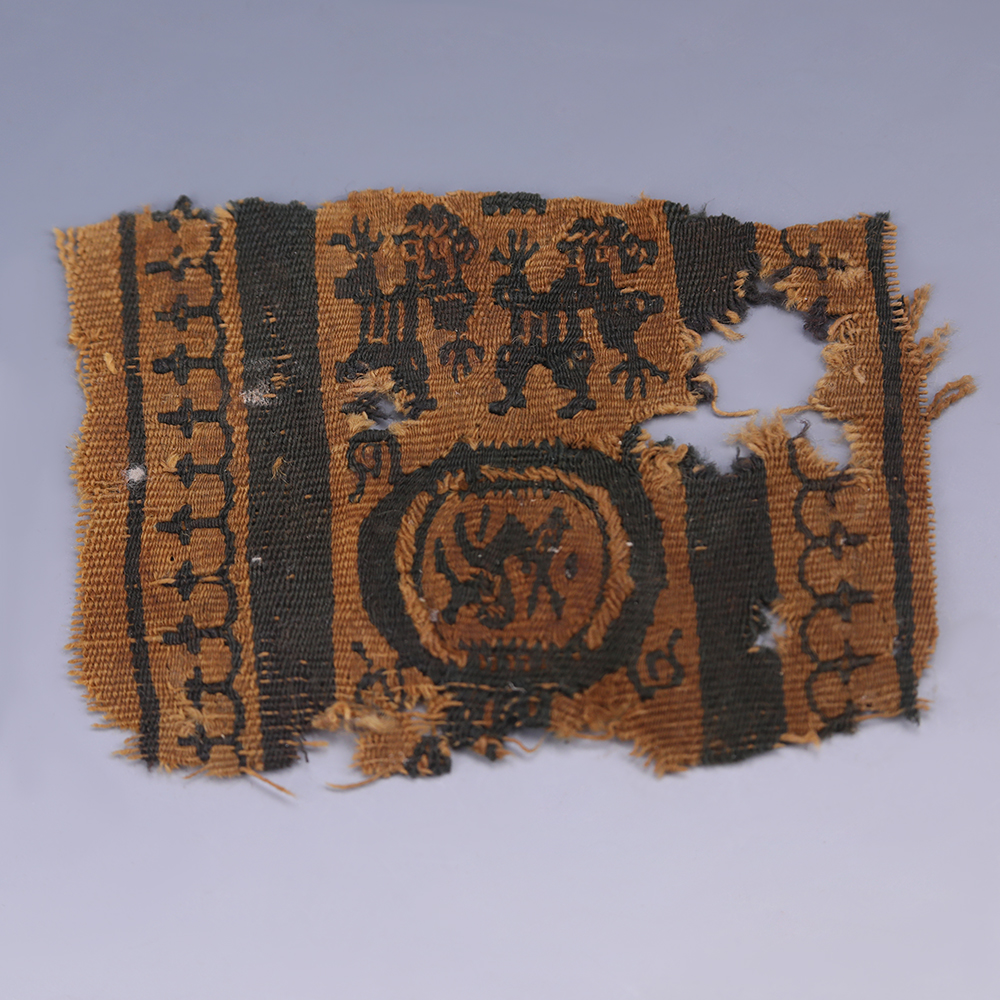 Coptic Textile Fragment with Dancers and Zoomorphic Figure graphic