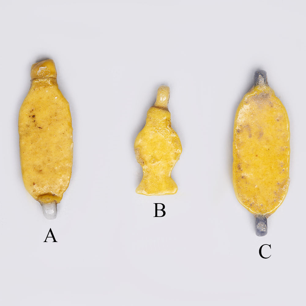 Selection of Egyptian Bright Yellow Glazed Faience Amulets Selection of Egyptian Bright Yellow Glazed Faience Amulets