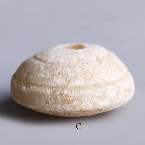 near eastern selection of alabaster spindle whorls c