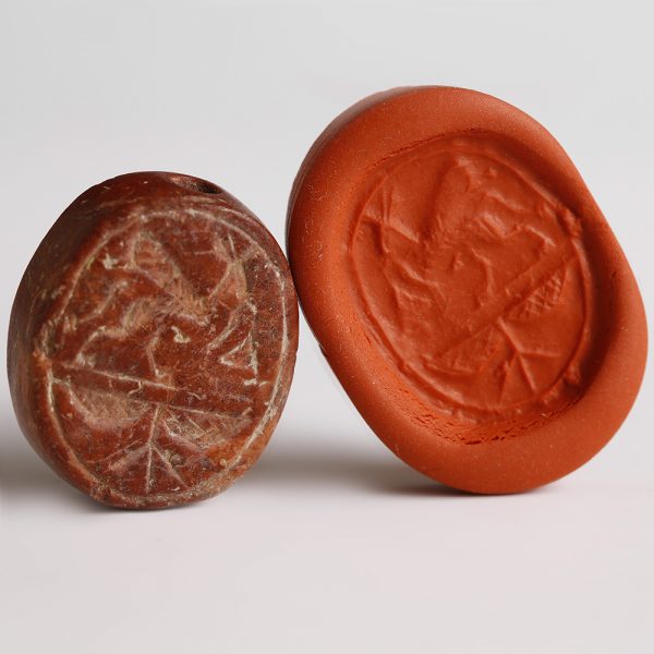 Southern Levantine Red Stone Scaraboid Seal with Griffin