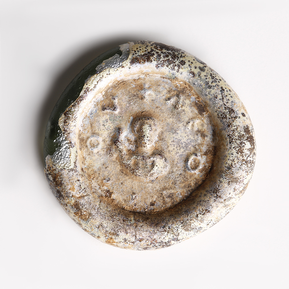 Byzantine Pale Blue Glass Weight with Impression of the Eparch Leontios Byzantine Pale Blue Glass Weight with Impression of the Eparch Leontios