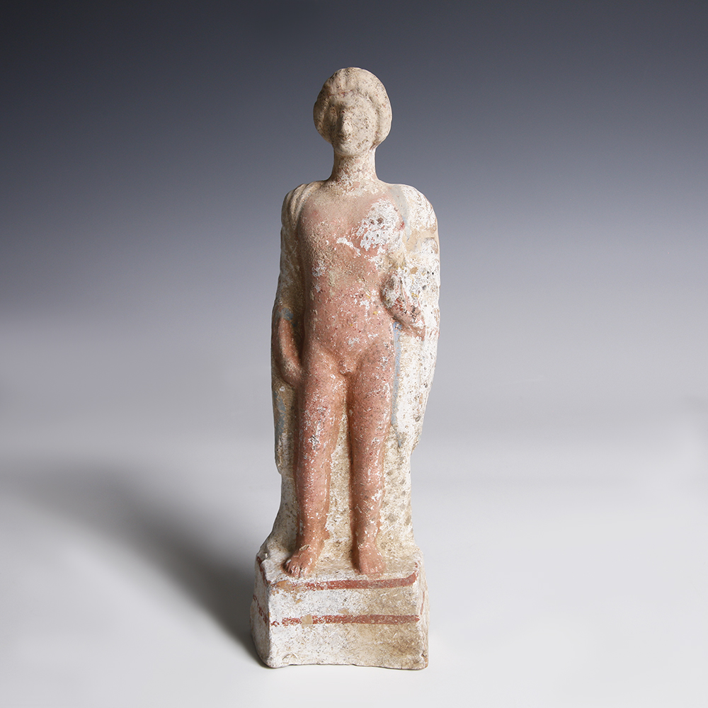 A Greek Terracotta Statuette of a Young Man A Greek Terracotta Statuette of a Young Man