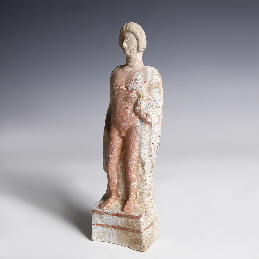 A Greek Terracotta Statuette of a Young Man A Greek Terracotta Statuette of a Young Man