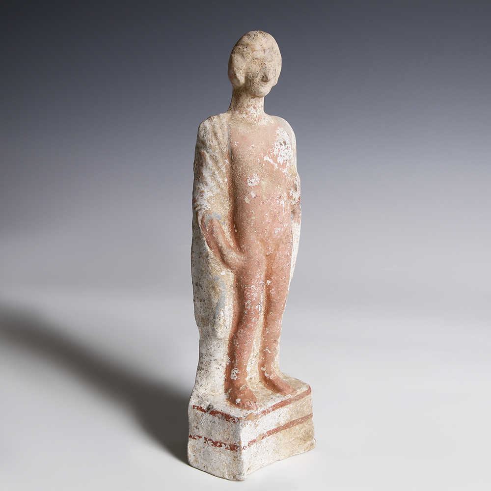 A Greek Terracotta Statuette of a Young Man A Greek Terracotta Statuette of a Young Man