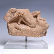 Tarentine Limestone Relief Fragment of a Crouching Man