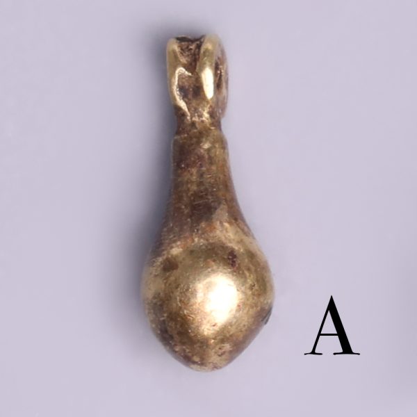 selection of egyptian gold teardrop amulets a