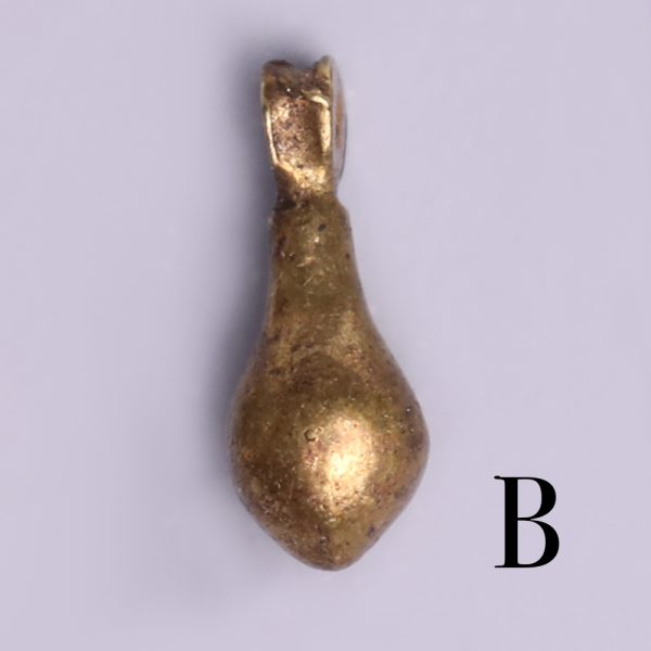 selection of egyptian gold teardrop amulets b