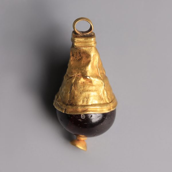 Western Asiatic Gold Pendant with a Garnet Bead