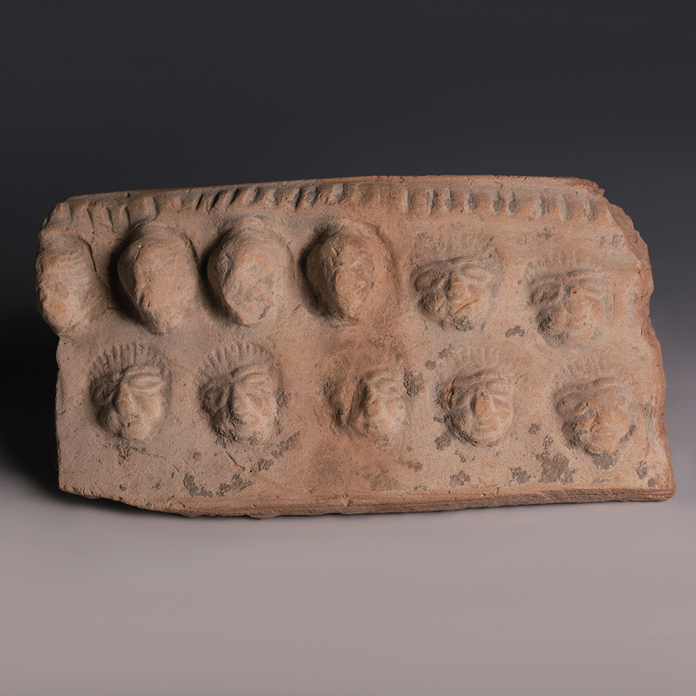 Near Eastern Terracotta Plaque Fragment with Portraits graphic