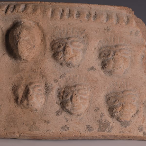 Near Eastern Terracotta Plaque Fragment with Portraits