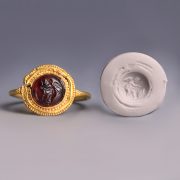 Roman Gold and Garnet Ring with Cupid