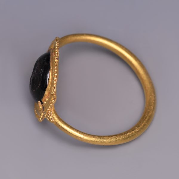 Roman Gold and Garnet Ring with Cupid
