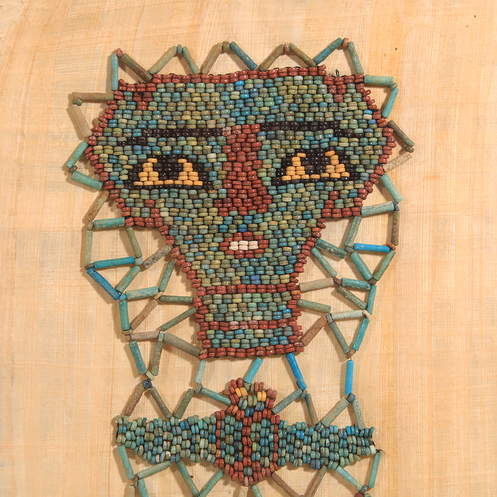 Selection of Ancient Egyptian Framed Beaded Mummy Masks with Funerary Face, Four Sons of Horus and Winged Scarab Selection of Ancient Egyptian Framed Beaded Mummy Masks with Funerary Face, Four Sons of Horus and Winged Scarab