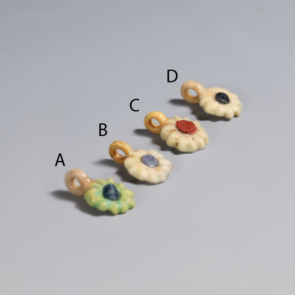 Selection of Ancient Egyptian Faience Daisy Amulet Selection of Ancient Egyptian Faience Daisy Amulet