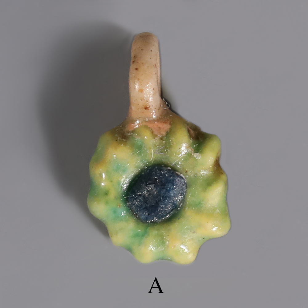 Selection of Ancient Egyptian Faience Daisy Amulet Selection of Ancient Egyptian Faience Daisy Amulet